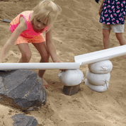 Children building with flexible sandbags in a classroom setting