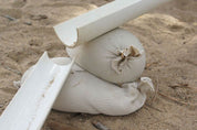 Children playing and building creatively with flexible sandbags in a classroom setting