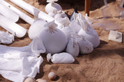 Children playing and building with flexible sandbags in a classroom setting