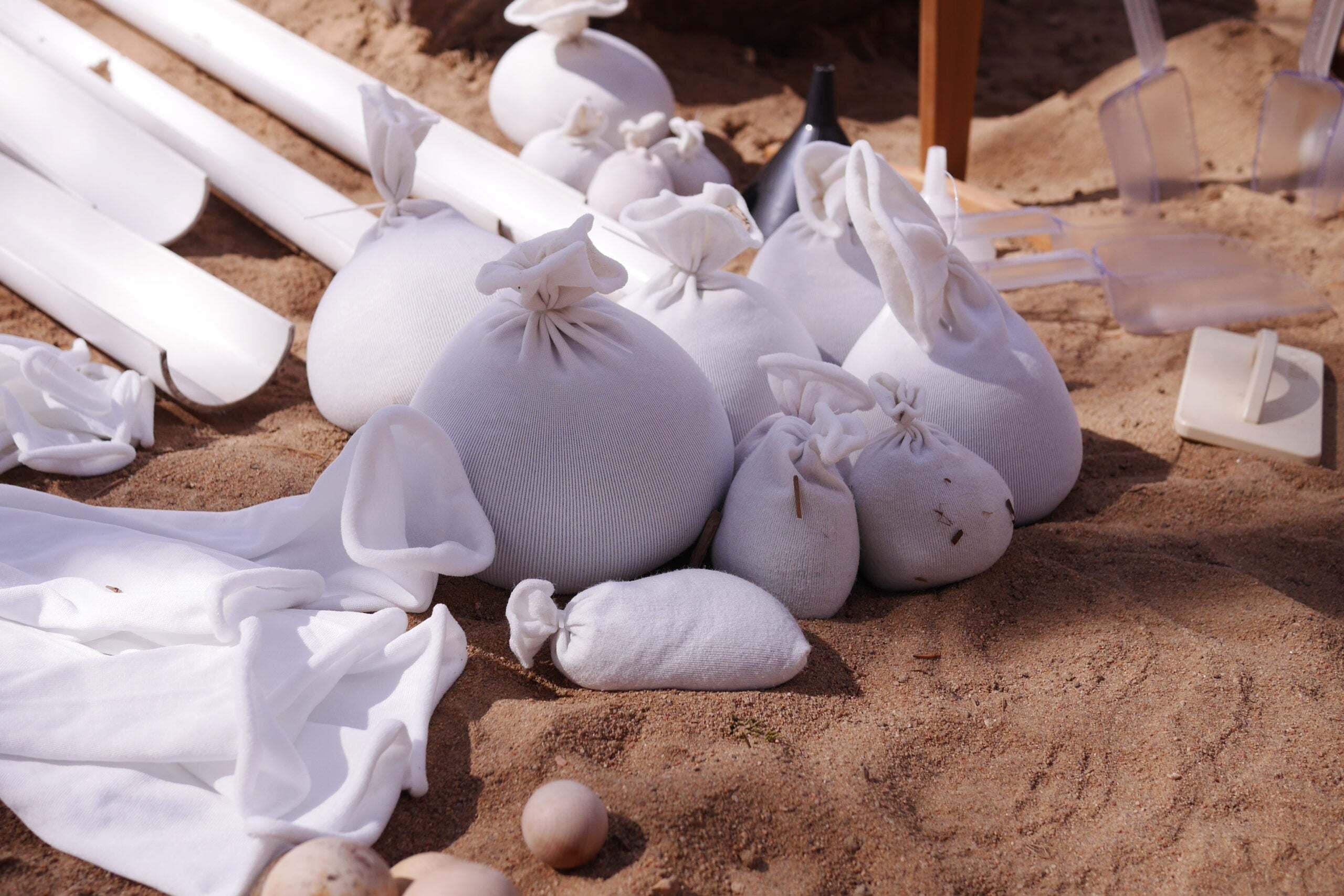 Children playing and building with flexible sandbags in a classroom setting