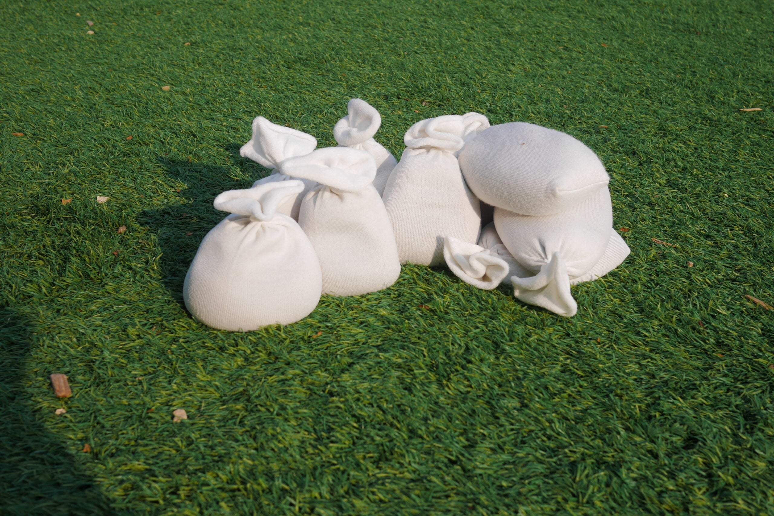 Children building with flexible sandbags for creative play and spatial skills development