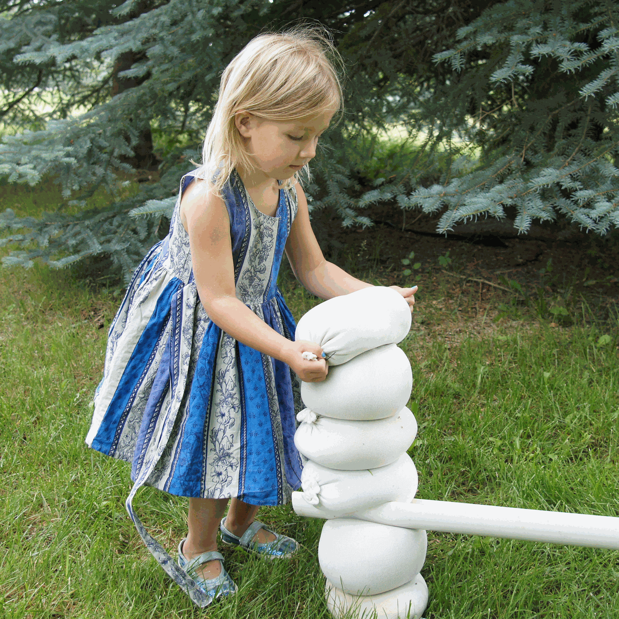Children playing with flexible sandbags used for creative building and spatial learning