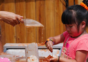Heavy-duty exploration scoops with ergonomic handles for sensory play