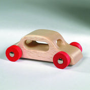 Wooden cars made of solid hardwood with steel axles on a ramp