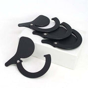 Set of four black, circular metal ramp gates with pivoting levers for Kodo 2023 ramp systems.