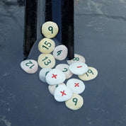 Number Pebbles sum-building set with engraved numerals and symbols for children’s counting and math activities