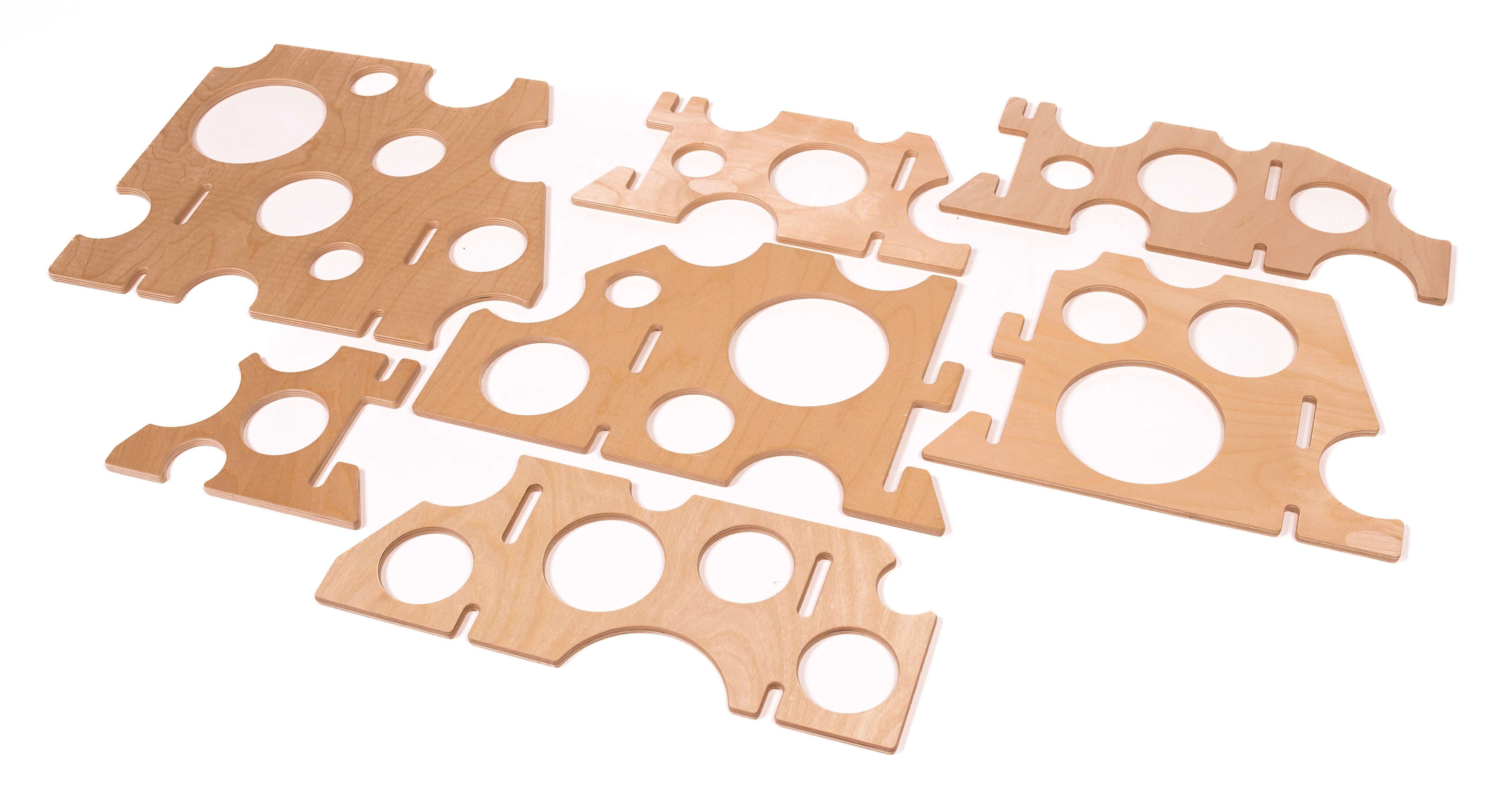 Set of light wood Swiss Ramp Stands with circular cutouts for STEM building and adjustable track angles.