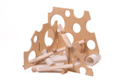 Swiss cheese-inspired wooden ramp stands with circular cutouts and marble tracks for STEM physics play.