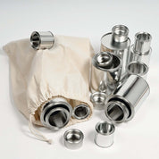 Set of 20 shiny silver metal tins in four sizes, displayed with a natural cotton drawstring storage bag.