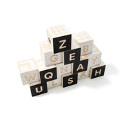 To Tonet Alphabet Blocks made of sustainable basswood with debossed letters and patterns for educational play