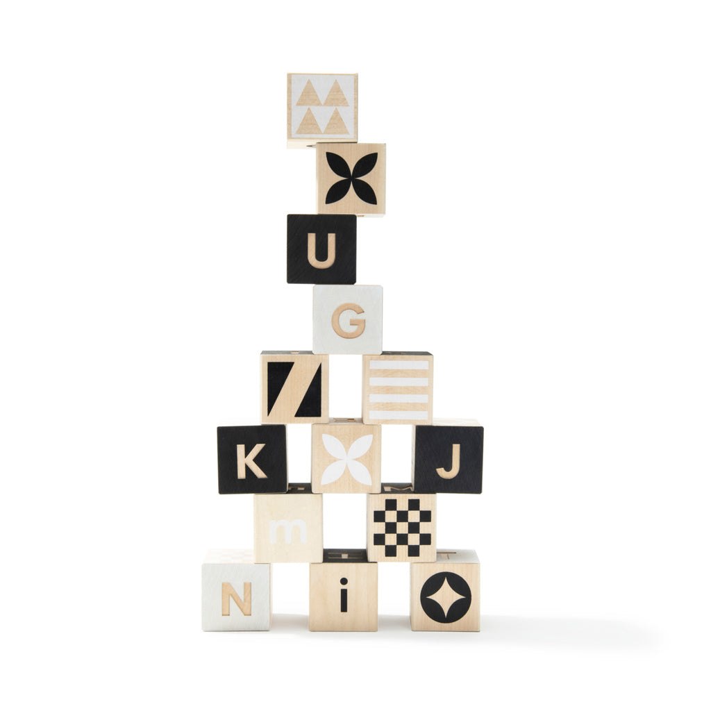 To Tonet Alphabet Blocks made of sustainable basswood with geometric and floral debossed patterns