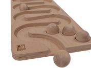 Natural wooden toddler ball run with winding tracks and smooth spheres for STEM learning and motor skill development.