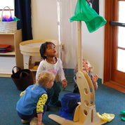Children experimenting with air movement in the Kodo Kids wind tunnel educational tool