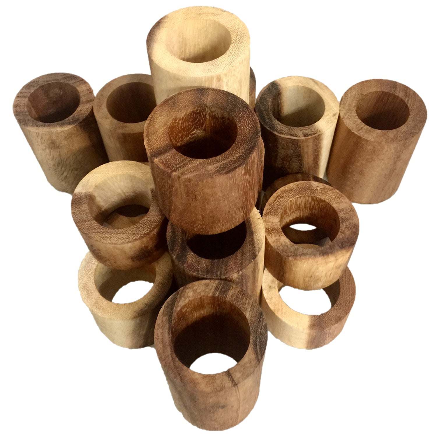 A collection of natural wooden tubes in varying light and dark brown wood grains, arranged in a cluster.