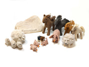 Handmade felt wool farm animal figurines including horses, sheep, and pigs with a storage bag on a white background.