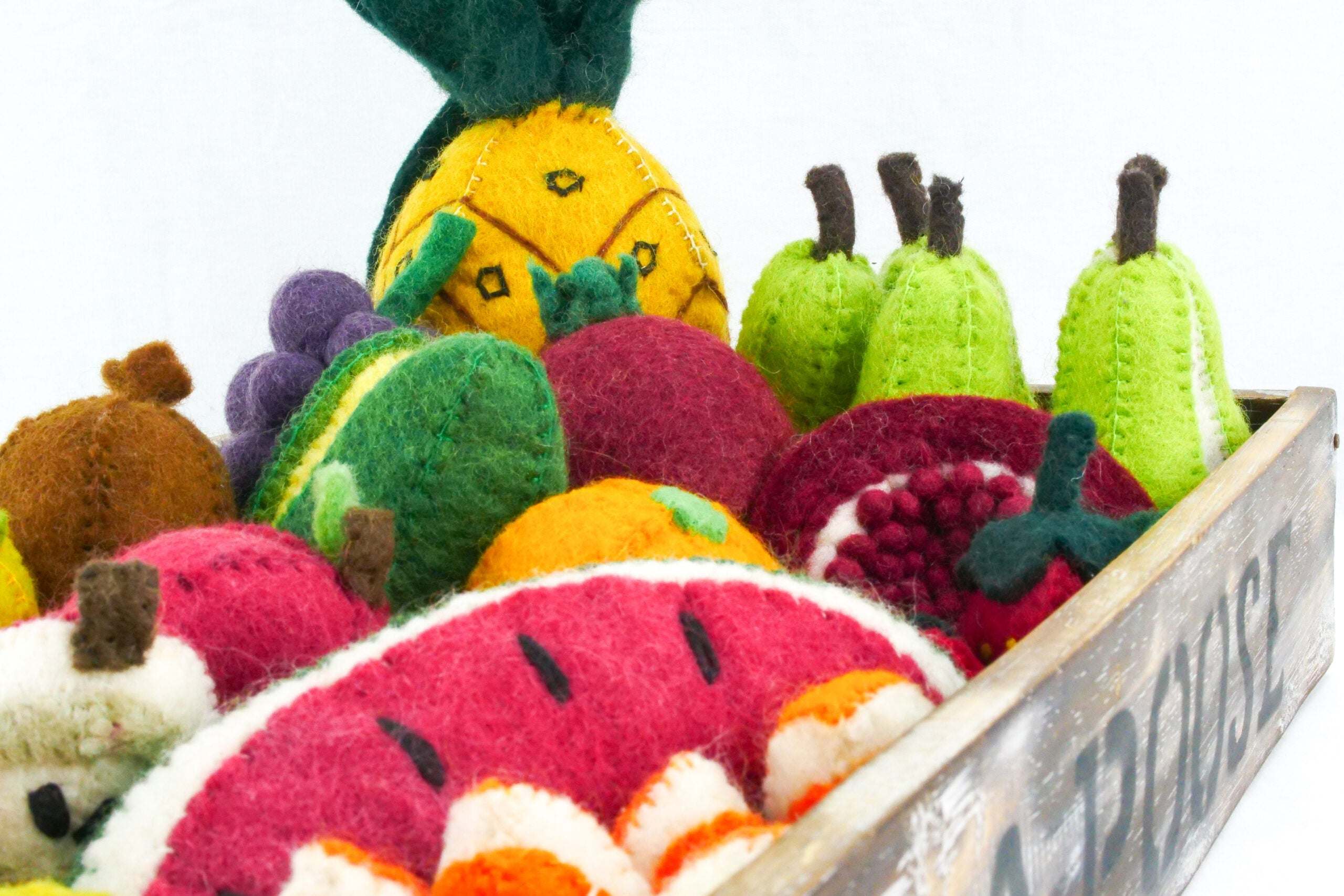 Colorful Wool Fruits Set including pears, pineapple, pomegranate, apple, and orange pieces for educational play and art activities.