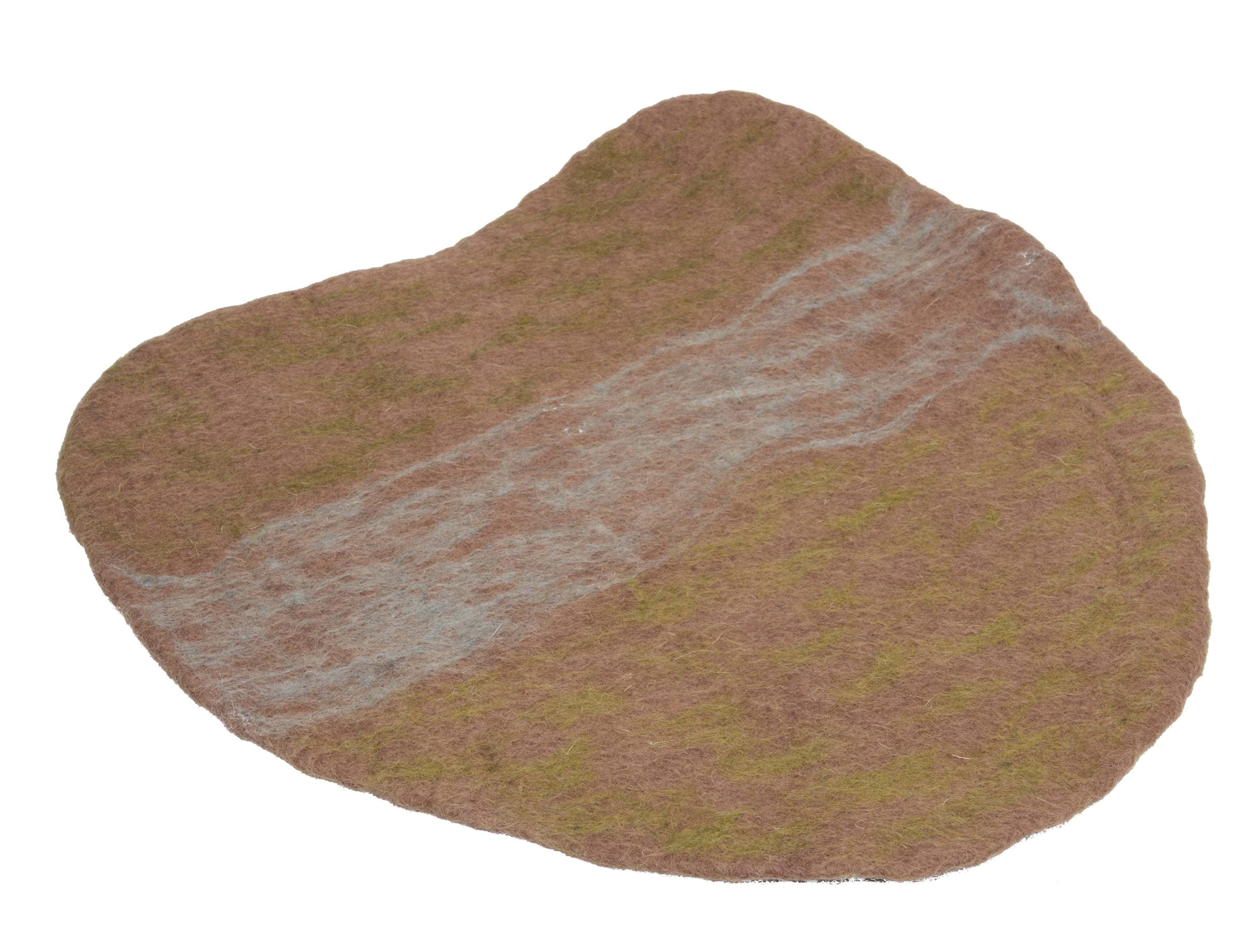 Irregularly shaped brown felted wool playscape mat with textured green and grey accents for sensory exploration.