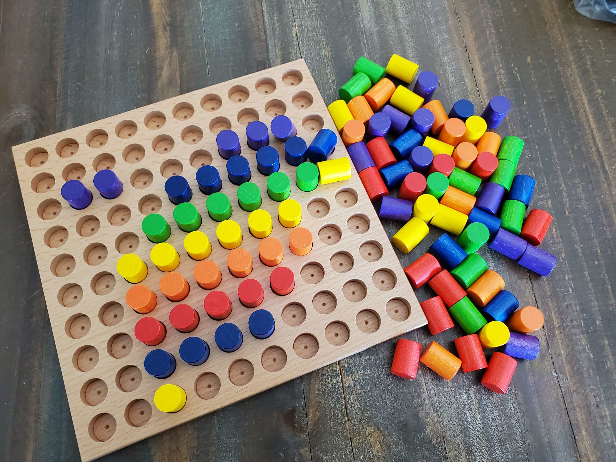 Toddlers Playing With Pegboard